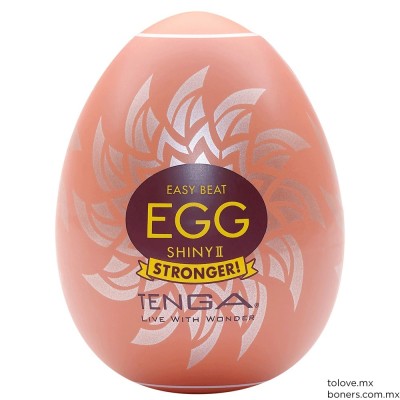 Huevo masturbador Tenga Egg Shiny II con textura en forma de sol. Imagen externa con etiqueta